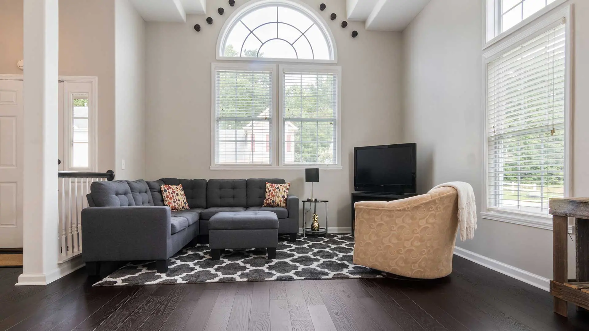 modern living room layout showcasing very dark, near-black hardwood flooring