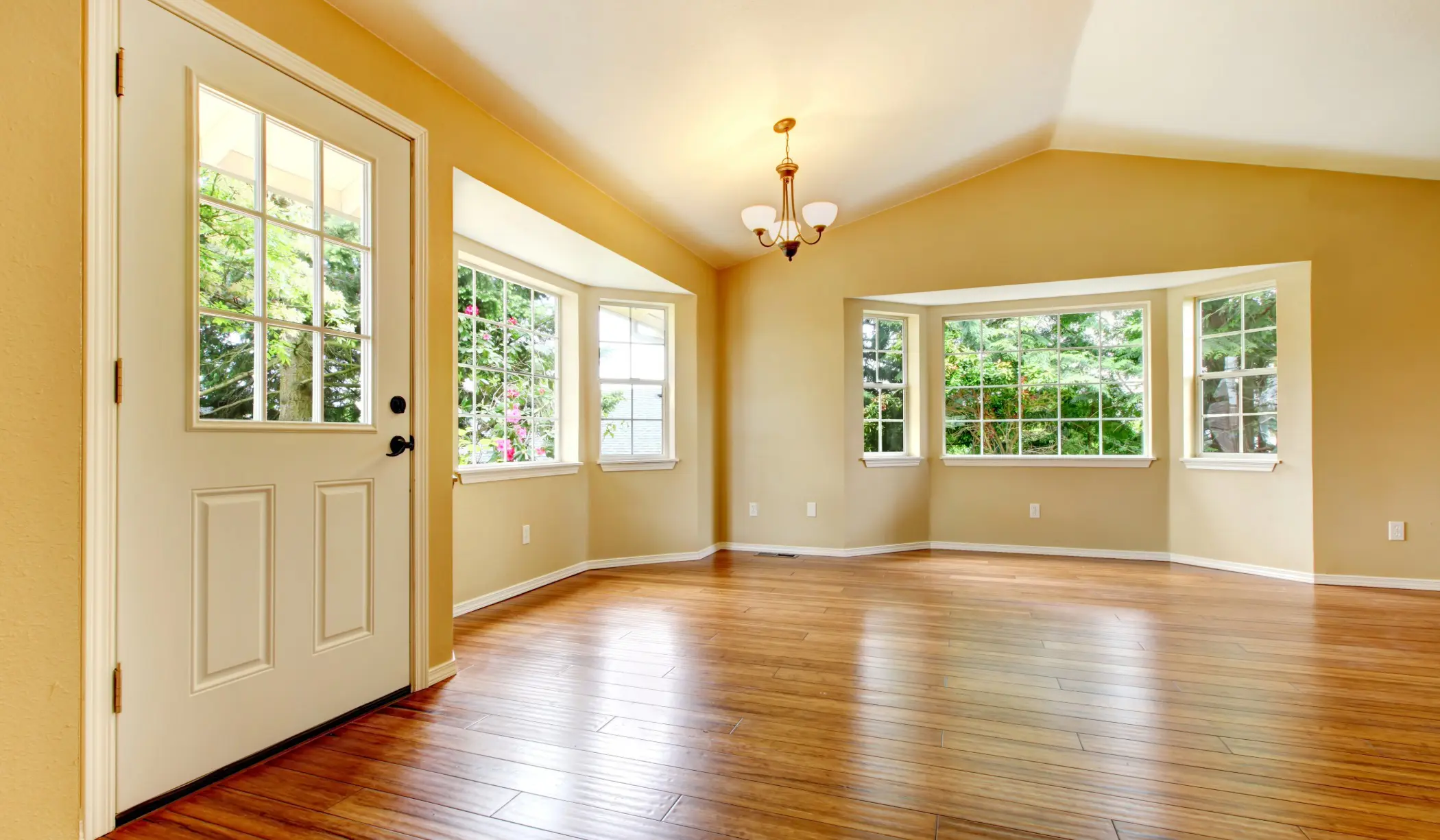 Living room with hardwood flooring installed by Romero Hardwood Floors, a Manchester, MA hardwood floor contractor.