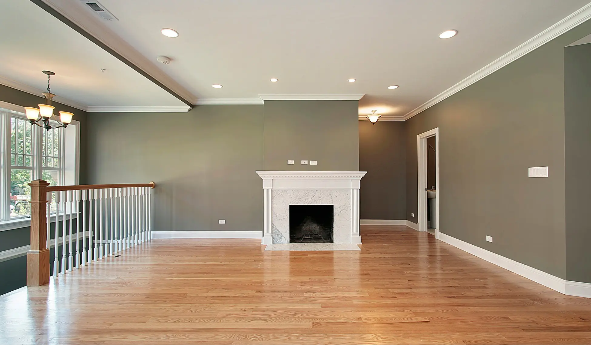 Modern living room with newly installed hardwood flooring by Romero Hardwood Floors, a professional hardwood floor contractor in Woburn, MA.
