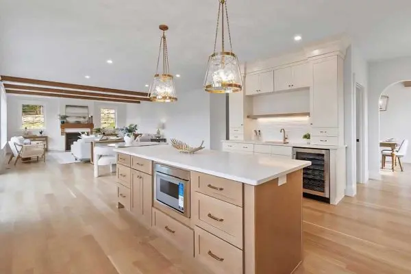 modern open-concept dining space featuring smooth light wood floors and large sliding glass doors in a revere ma residence
